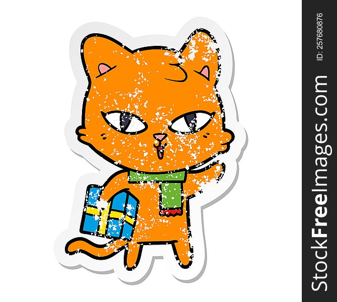 distressed sticker of a cartoon cat with a present