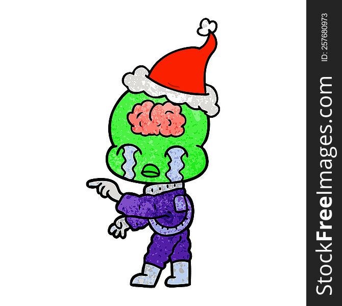 hand drawn textured cartoon of a big brain alien crying and pointing wearing santa hat