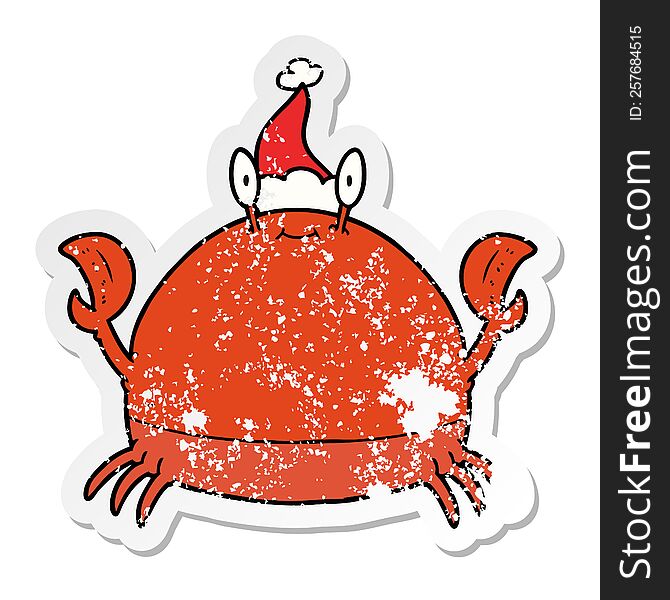 hand drawn distressed sticker cartoon of a crab wearing santa hat