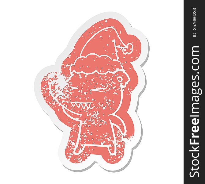 angry polar bear quirky cartoon distressed sticker of a wearing santa hat