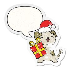 Cute Cartoon Puppy And Christmas Present And Hat And Speech Bubble Distressed Sticker Stock Photos