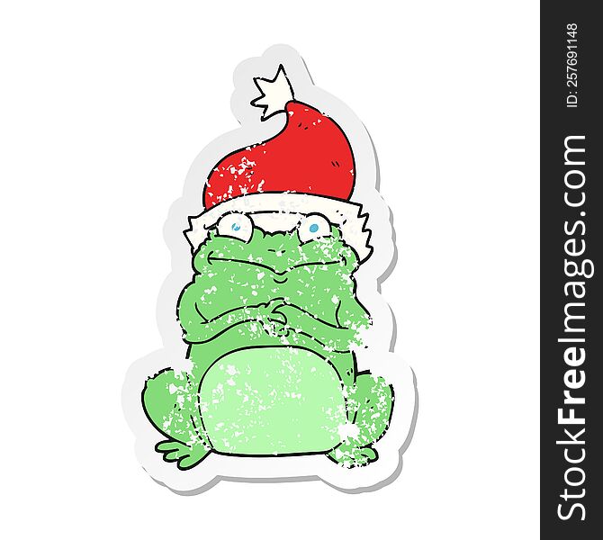 Retro Distressed Sticker Of A Cartoon Frog Wearing Christmas Hat
