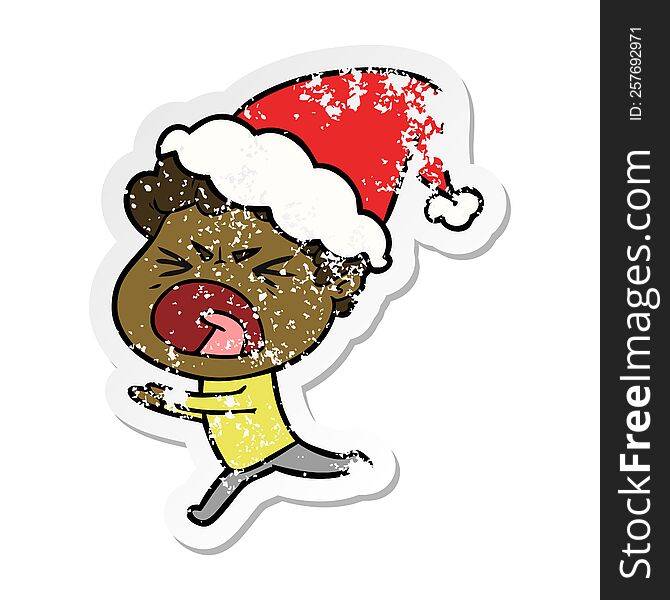 hand drawn distressed sticker cartoon of a furious man wearing santa hat