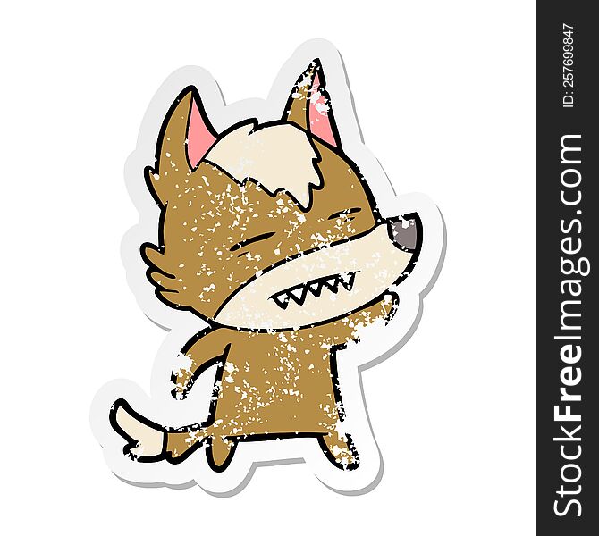 distressed sticker of a cartoon wolf waving showing teeth
