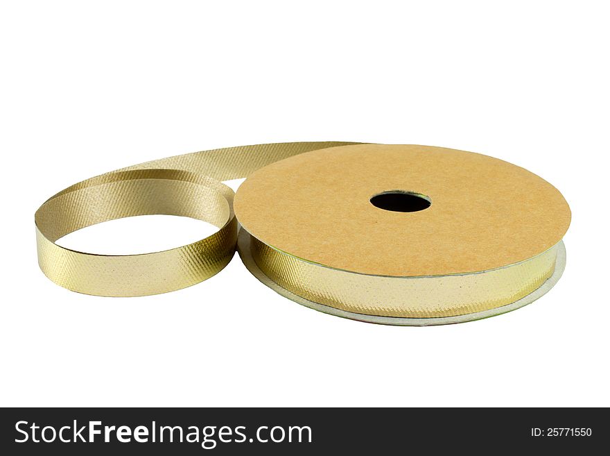 Roll of gold ribbon solated on white background. Roll of gold ribbon solated on white background