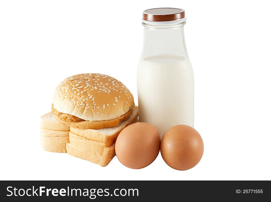 Milk bottle, eggs and bread. Isolated on white background.