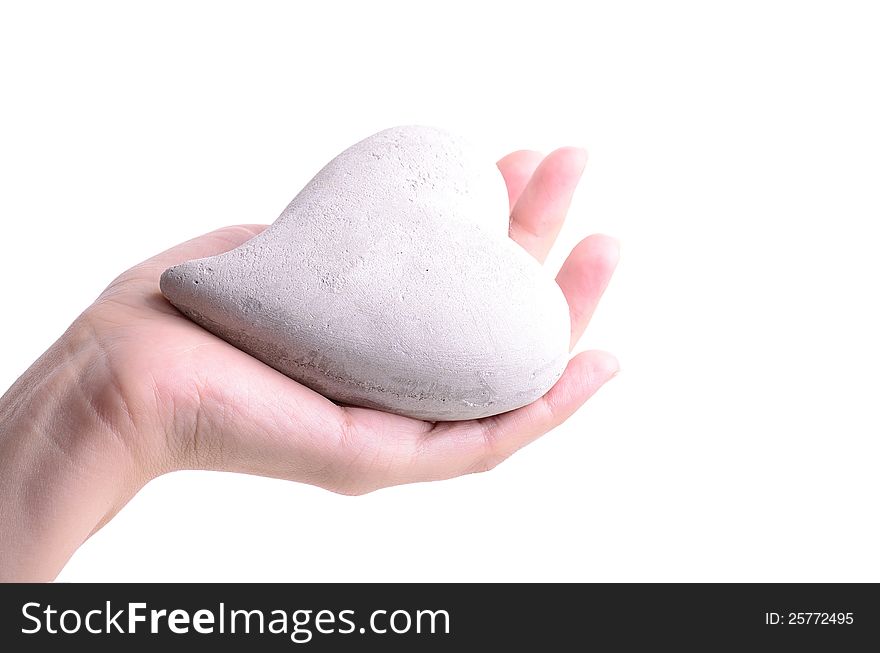 Woman holding a stone heart in his hand