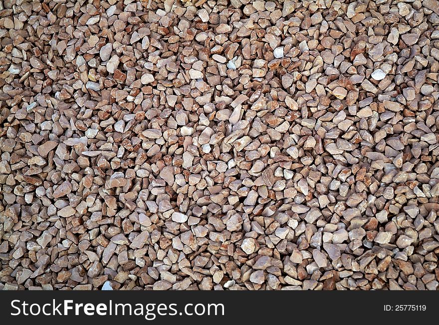 Red little stones background red. Red little stones background red