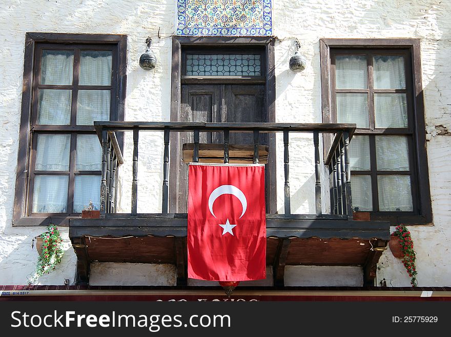 Taken in Kas Turkey in April showing the Turkish flag on an old Balcony. Taken in Kas Turkey in April showing the Turkish flag on an old Balcony