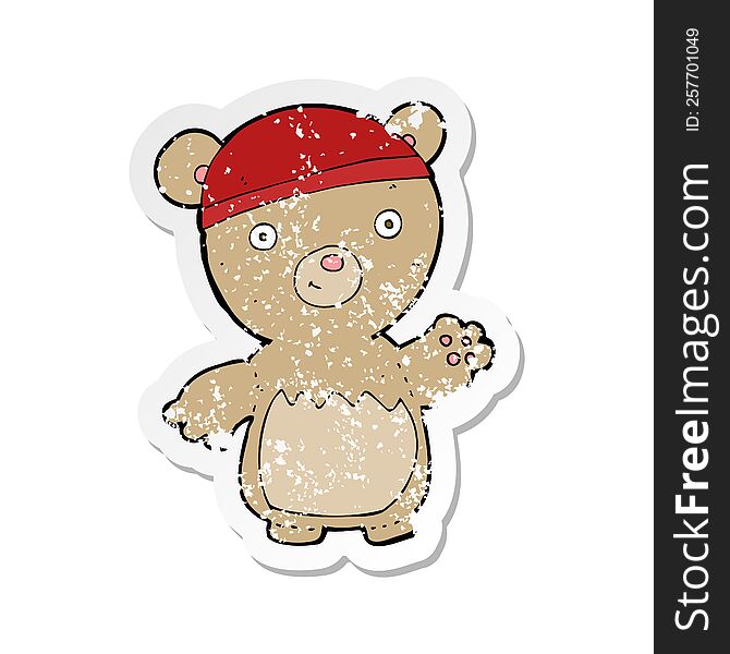 Retro Distressed Sticker Of A Cartoon Teddy Bear Wearing Hat