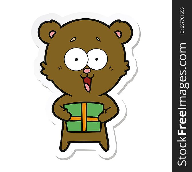 sticker of a laughing teddy  bear with christmas present