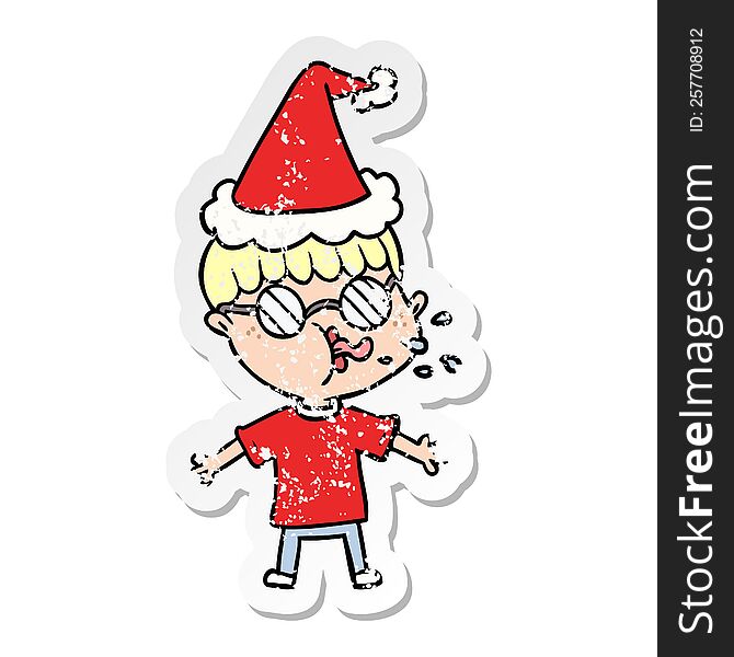 hand drawn distressed sticker cartoon of a boy wearing spectacles wearing santa hat