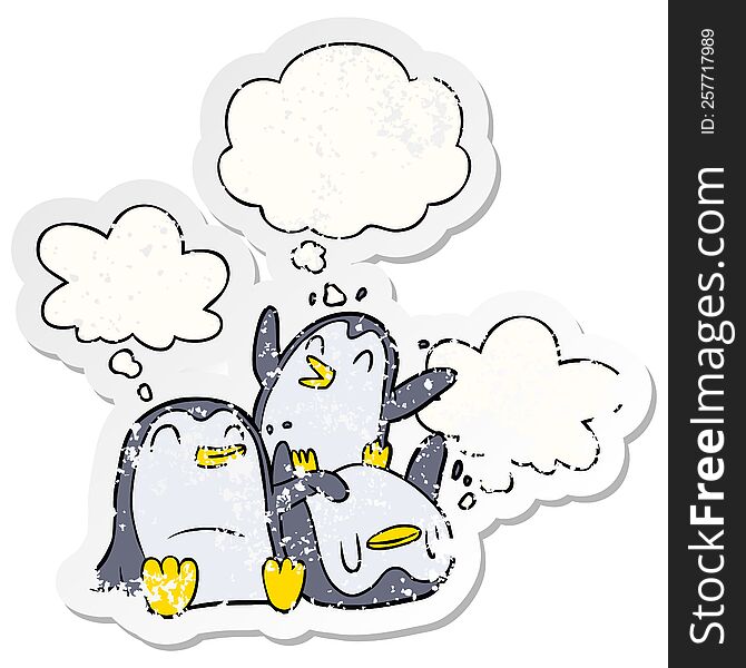cartoon penguins and thought bubble as a distressed worn sticker