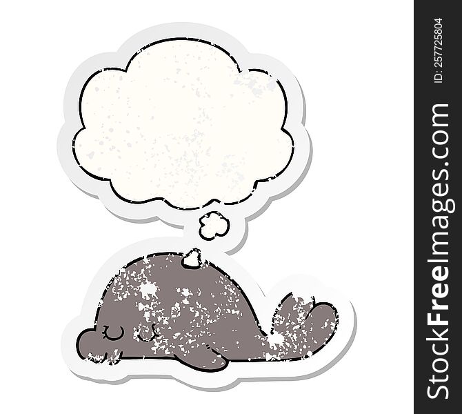 cartoon seal with thought bubble as a distressed worn sticker