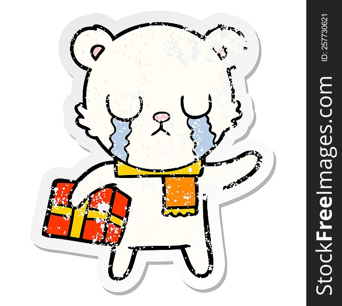 distressed sticker of a crying polar bear cartoon with christmas gift