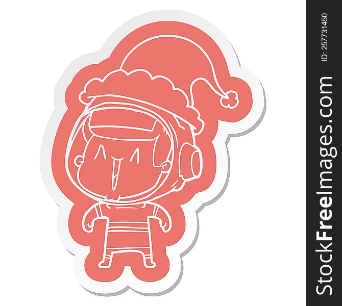 quirky cartoon  sticker of a astronaut man wearing santa hat