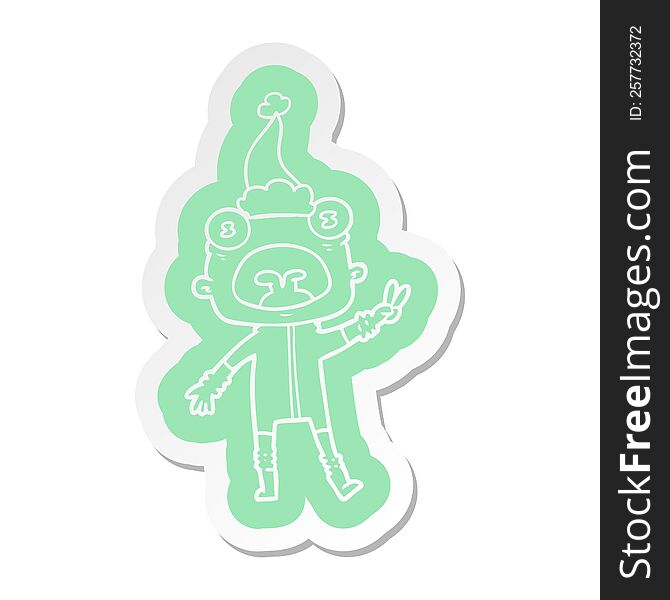 Cartoon  Sticker Of A Weird Alien Waving Wearing Santa Hat