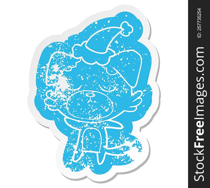 Cute Cartoon Distressed Sticker Of A Dog Wearing Santa Hat