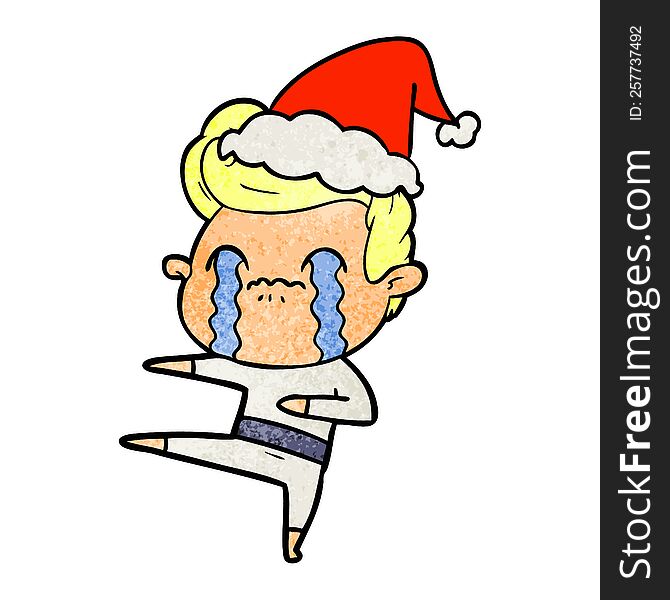 hand drawn textured cartoon of a man crying wearing santa hat