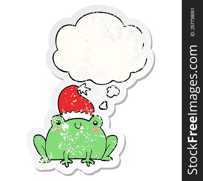 cute cartoon christmas frog with thought bubble as a distressed worn sticker