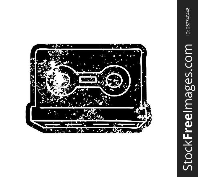 grunge distressed icon of a retro cassette tape. grunge distressed icon of a retro cassette tape