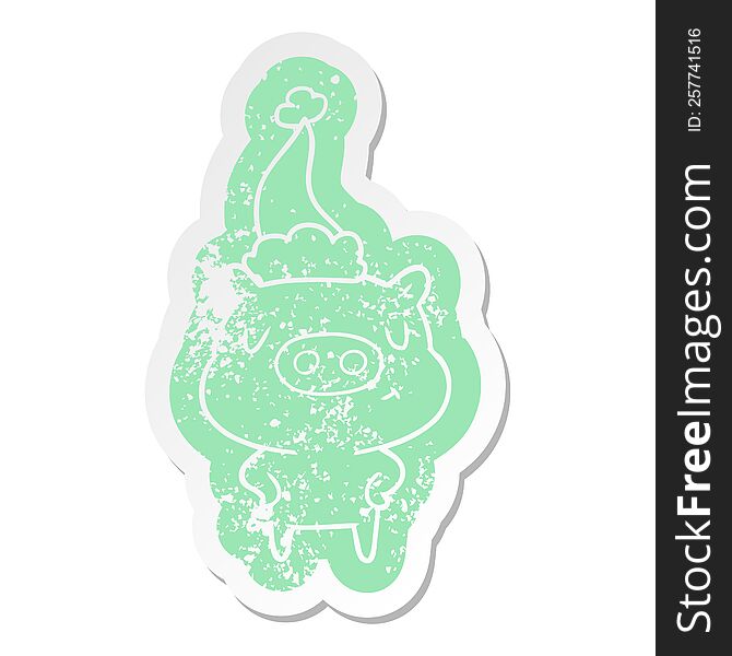 Cartoon Distressed Sticker Of A Content Pig Wearing Santa Hat