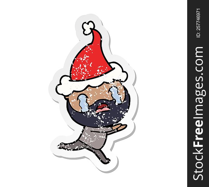 Distressed Sticker Cartoon Of A Bearded Man Crying Wearing Santa Hat