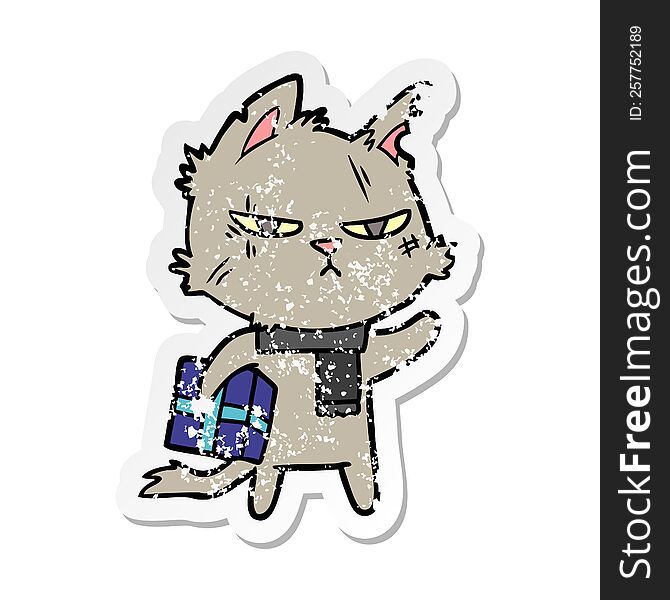 distressed sticker of a tough cartoon cat with christmas present