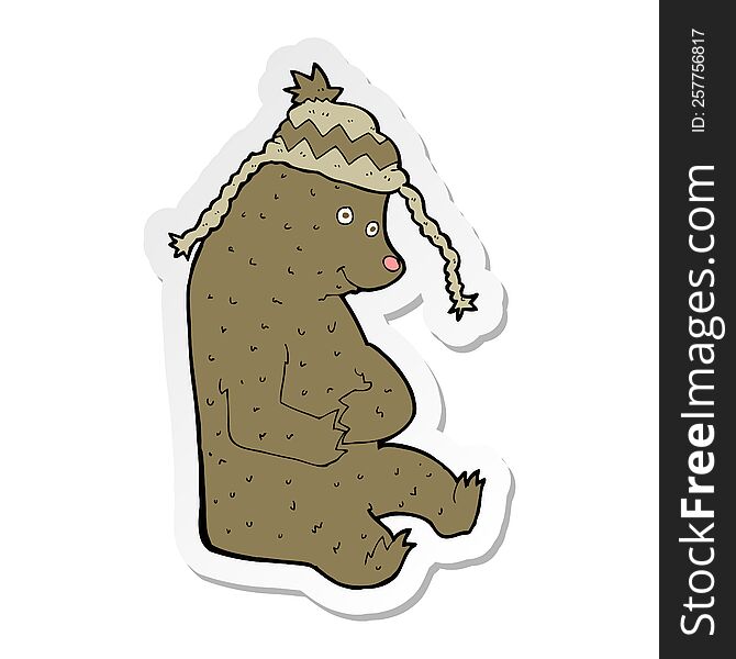 sticker of a cartoon bear in winter hat