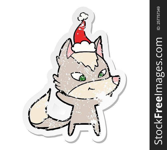 Friendly Distressed Sticker Cartoon Of A Wolf Wearing Santa Hat