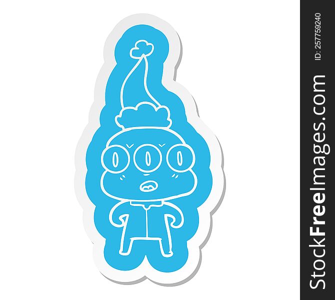 quirky cartoon  sticker of a three eyed alien wearing santa hat