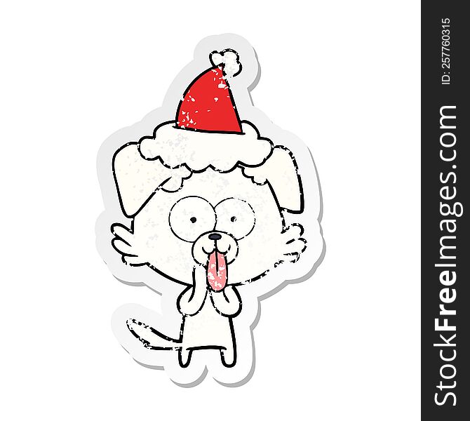 hand drawn distressed sticker cartoon of a dog with tongue sticking out wearing santa hat