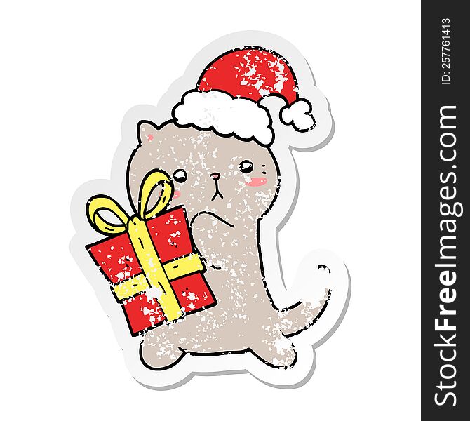distressed sticker of a cute cartoon cat carrying christmas present