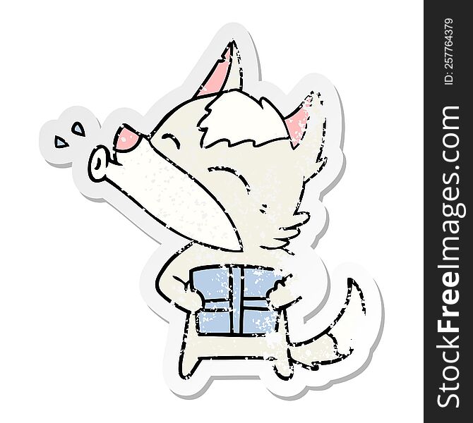 distressed sticker of a howling wolf with christmas present