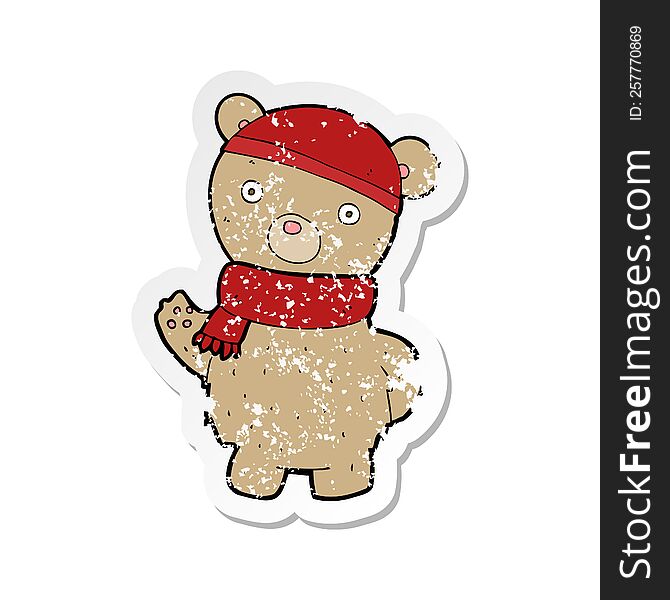 retro distressed sticker of a cartoon teddy bear in winter hat and scarf