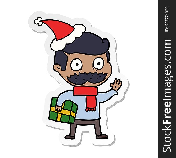hand drawn sticker cartoon of a man with mustache and christmas present wearing santa hat