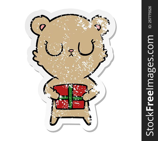 distressed sticker of a peaceful cartoon bear with present