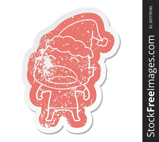 cartoon distressed sticker of a shouting bald man wearing santa hat