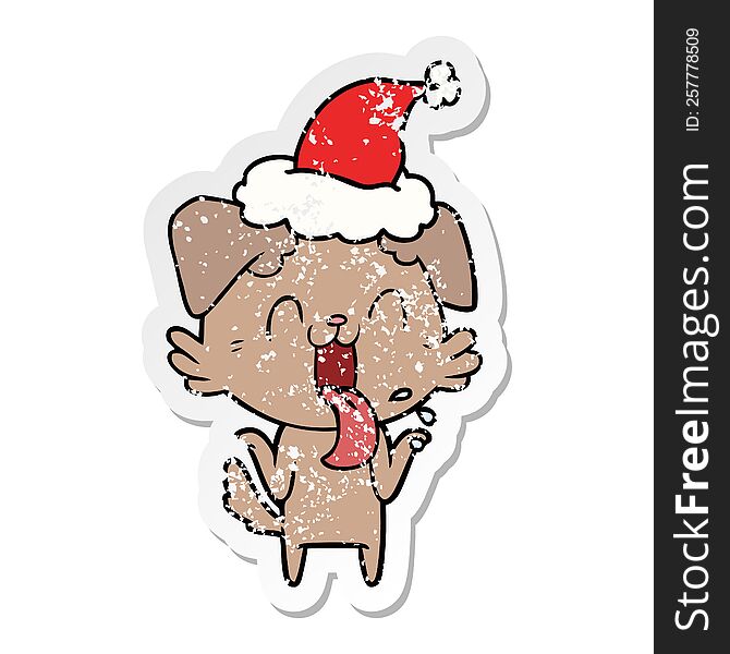 hand drawn distressed sticker cartoon of a panting dog shrugging shoulders wearing santa hat