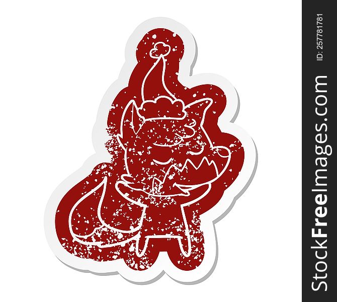 Friendly Cartoon Distressed Sticker Of A Fox Wearing Santa Hat