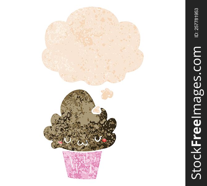 cartoon cupcake with face with thought bubble in grunge distressed retro textured style. cartoon cupcake with face with thought bubble in grunge distressed retro textured style
