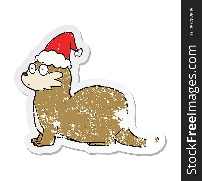 hand drawn distressed sticker cartoon of a otter wearing santa hat