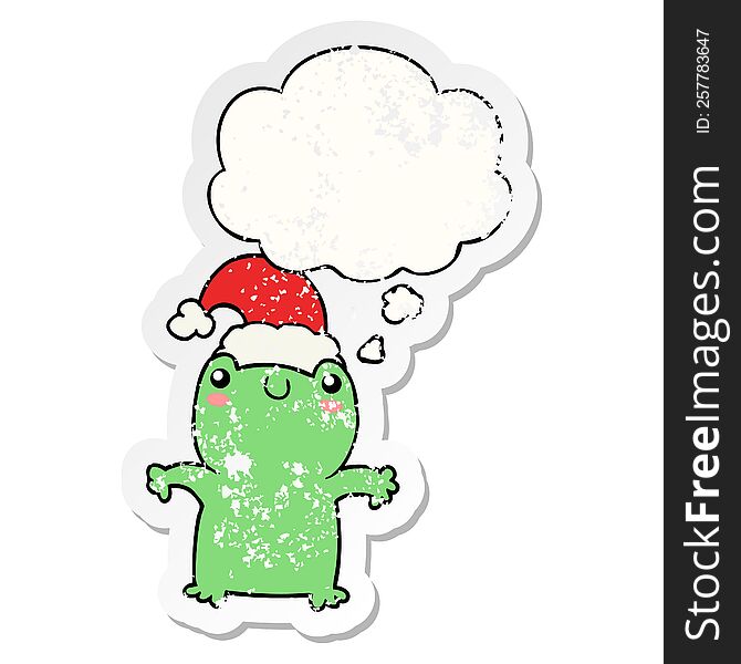 cute cartoon frog wearing christmas hat with thought bubble as a distressed worn sticker
