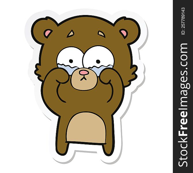 sticker of a cartoon crying bear rubbing eyes