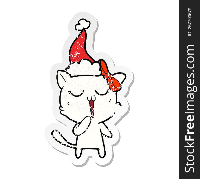 Distressed Sticker Cartoon Of A Cat Wearing Santa Hat