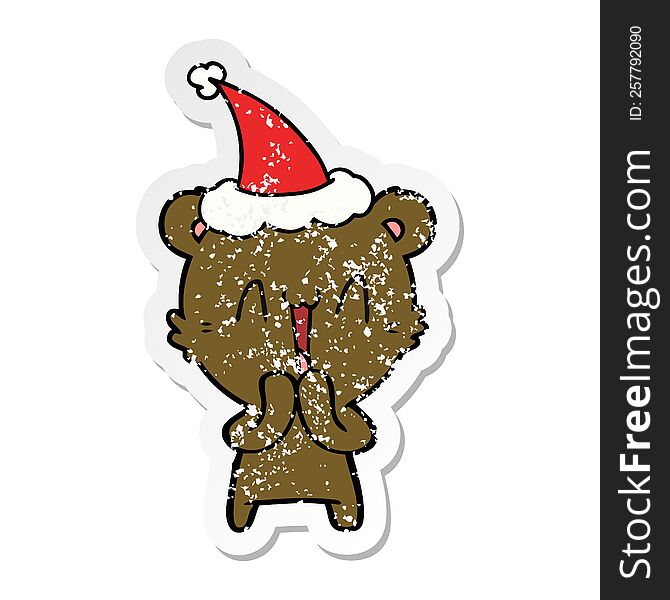 happy bear hand drawn distressed sticker cartoon of a wearing santa hat. happy bear hand drawn distressed sticker cartoon of a wearing santa hat