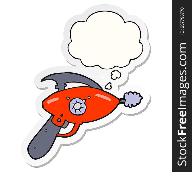 cartoon ray gun with thought bubble as a printed sticker