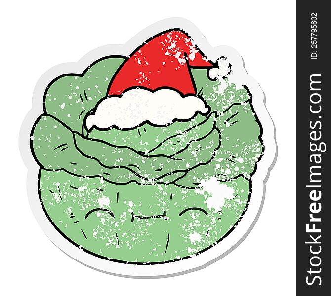 hand drawn distressed sticker cartoon of a cabbage wearing santa hat
