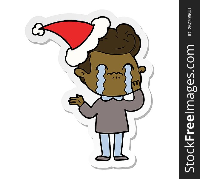 hand drawn sticker cartoon of a man crying wearing santa hat