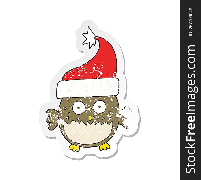 Retro Distressed Sticker Of A Cartoon Owl Wearing Christmas Hat